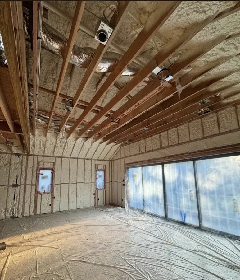 Interior walls and ceiling insulated with spray foam during new construction in Brighton